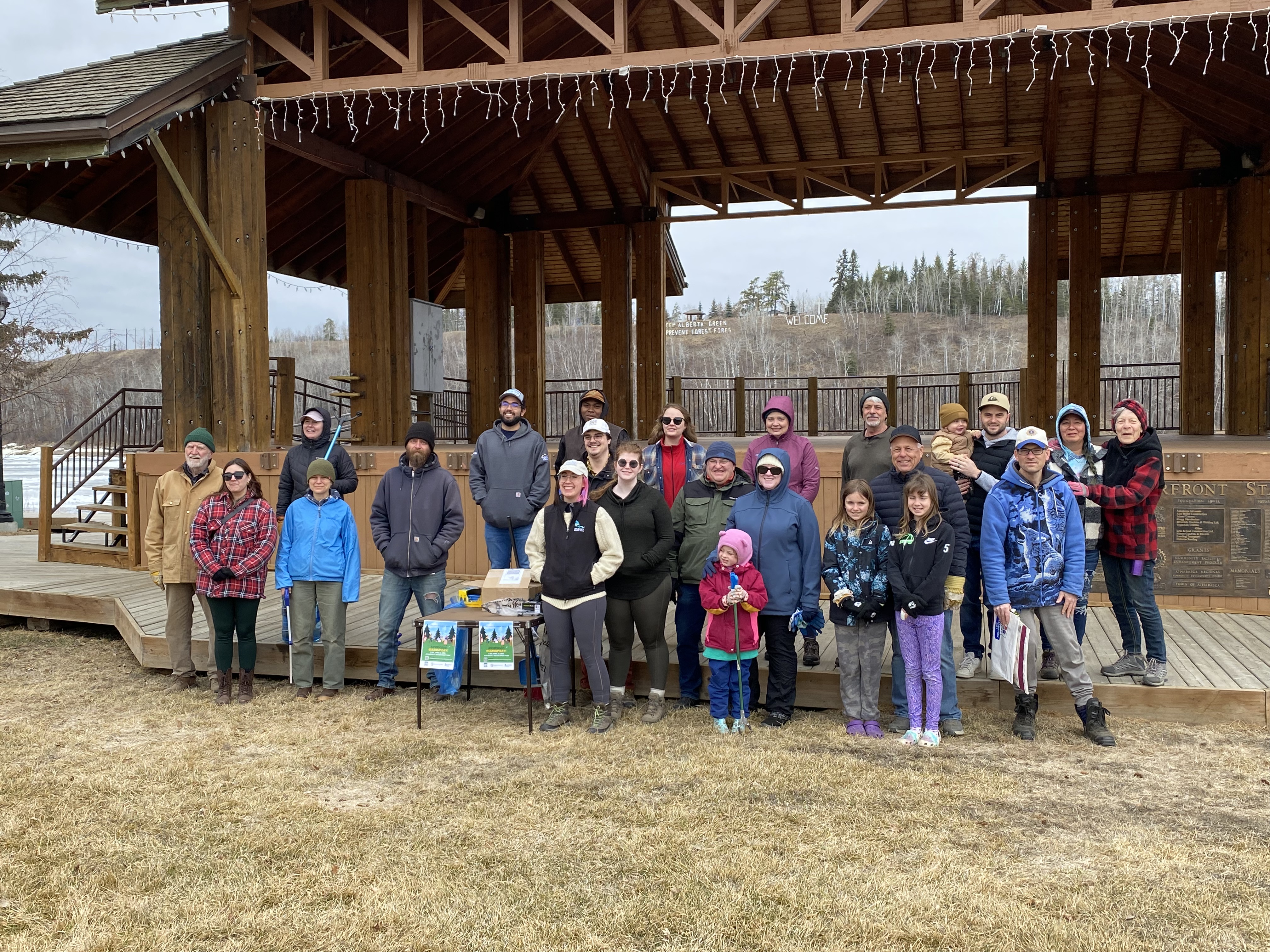 group of people posing at the Athabasca waterfront after spring cleanup
